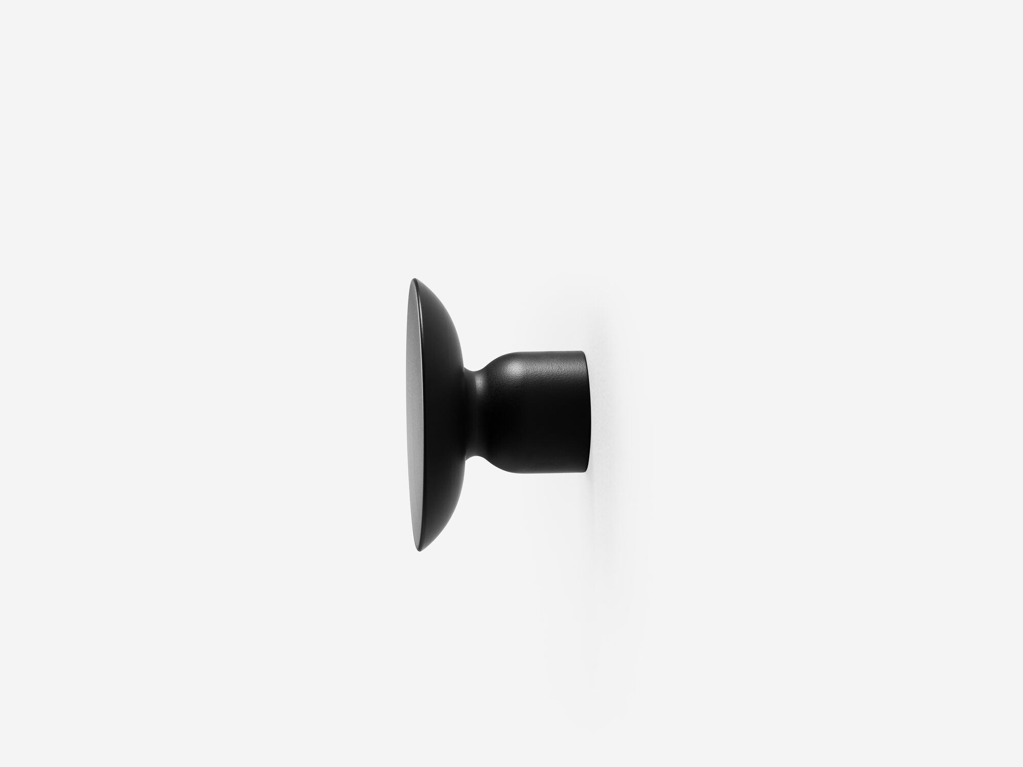 Large black wall knob side view